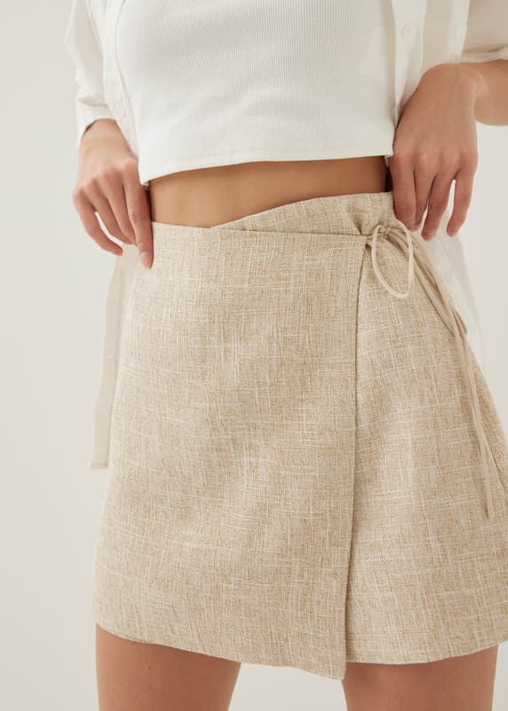Marguerite cream wrap mini skirt 2025