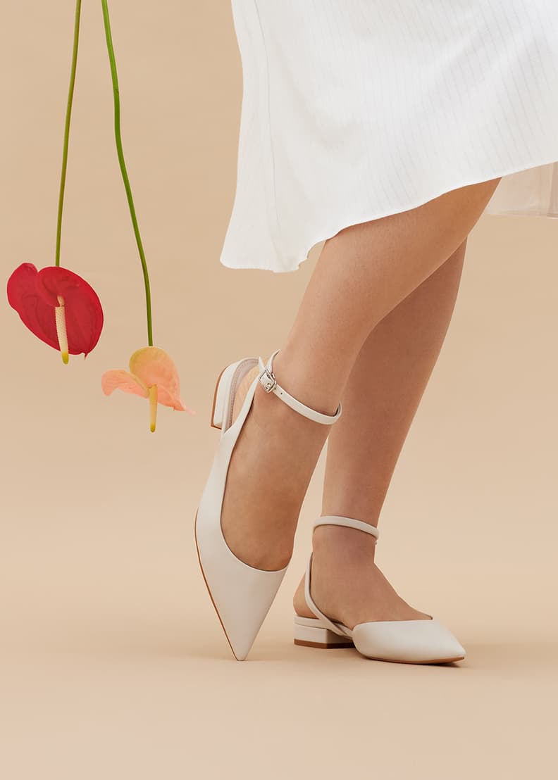 White pointed heels with ankle strap top